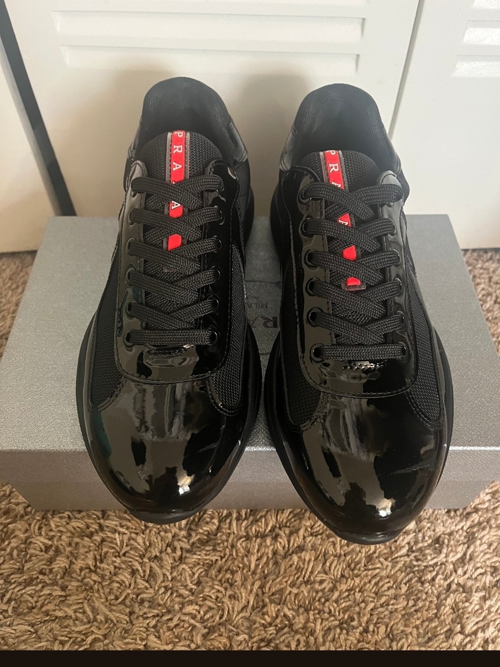 Prada Men's Black Sneakers with Red Logo Tongue